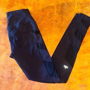 Black ALO leggings with cute cut out mesh details down side of leg. Size 2